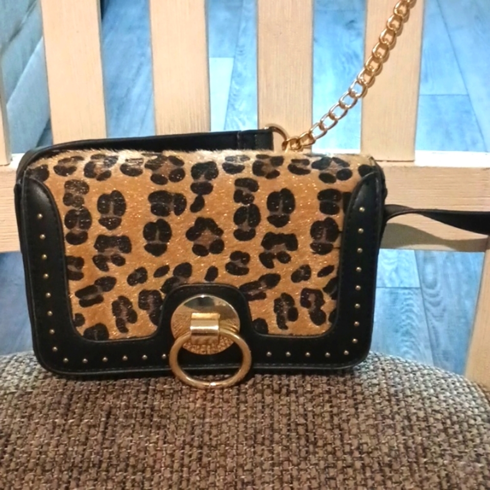 Charlette Russe purse, animal print. Gold tone strap.